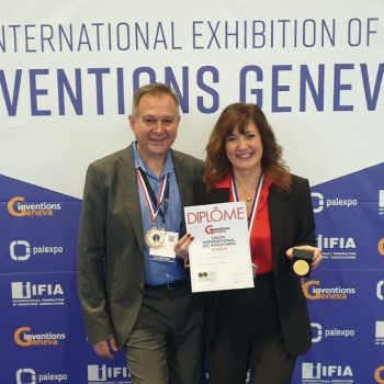 a man and woman holding medals and a medal