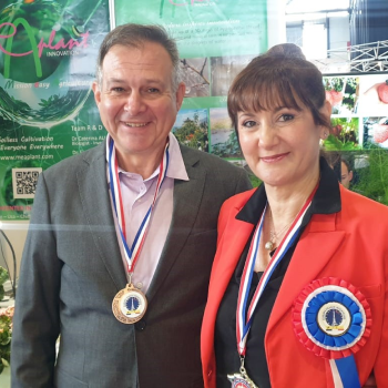 a man and woman with medals